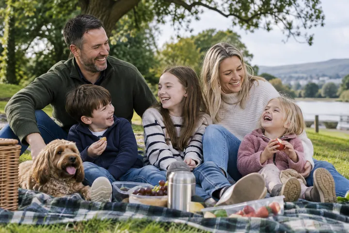 A family sharing a picnic in a park