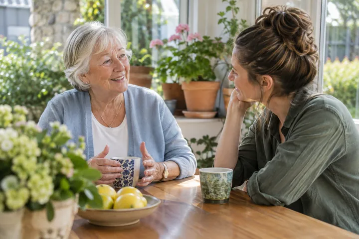 Two adults discussing future plans in a conservatory