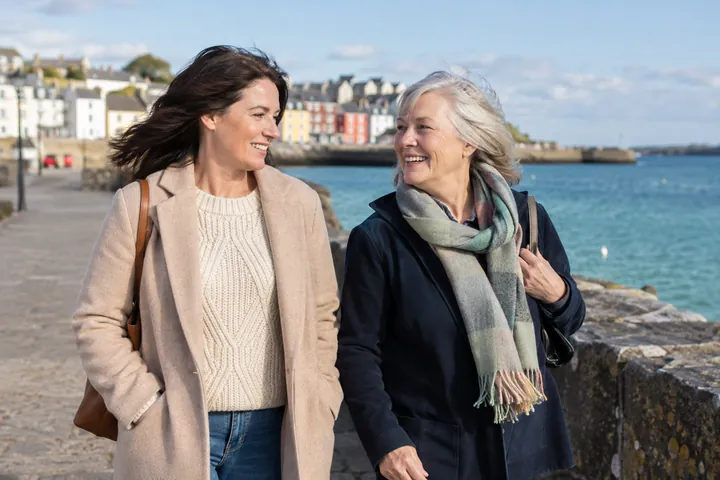 Two women talking during a harbour walk